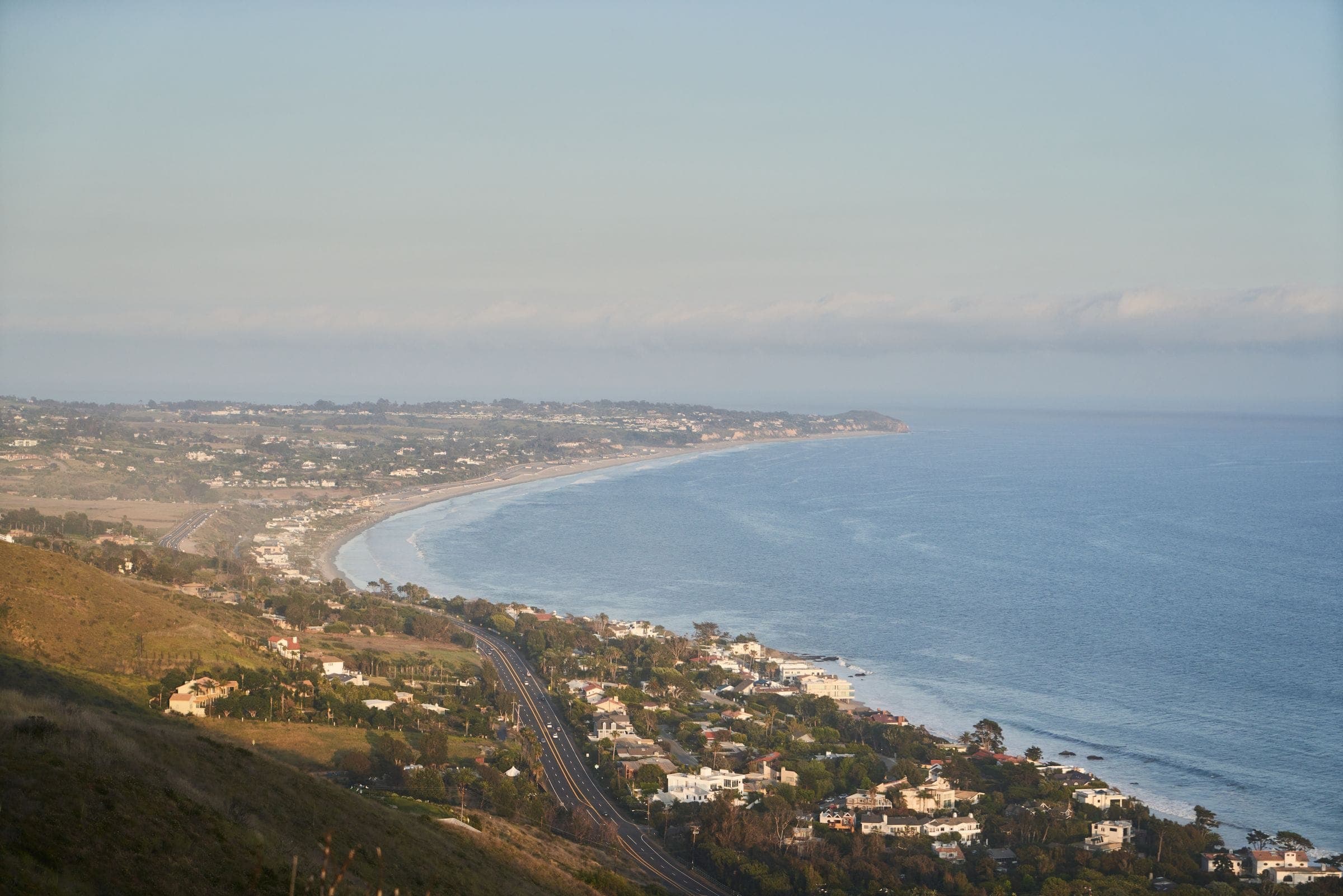 The Southern California coastline curving away below the hills